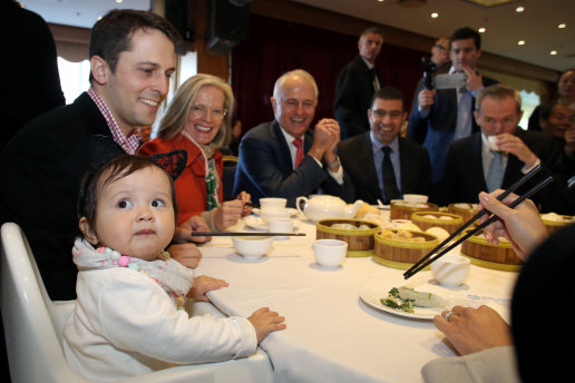 Malcolm Turnbull’s granddaughter Isla (left) looks at the media during a family lunch with his wife Lucy and son Alex (second left) at the Sunny Harbour Yum Cha in Hurstville during the 2016 election campaign. 