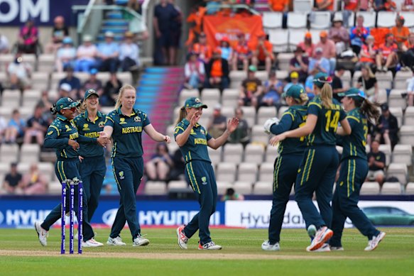 Australia celebrates during their 98-run win over the Netherlands.