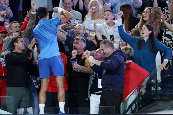 Novak Djokovic celebrates with his team.