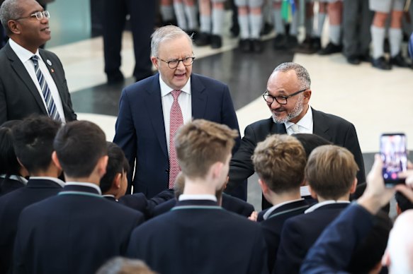 Prime Minister Anthony Albanese and Prime Minister of Solomon Islands Matthew Wale greet schoolchildren after a ceremonial welcome on the forecourt of Parliament House in Canberra.