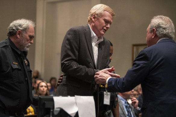 Alex Murdaugh, center, is handcuffed in the courtroom after a guilty verdict of his double murder trial was read aloud at Colleton County Courthouse in Walterboro, South Carolina.