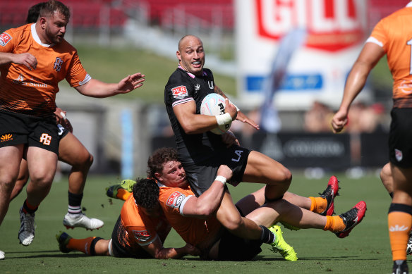 Billy Meakes is tackled in a clash against the Austin Gilgronis.