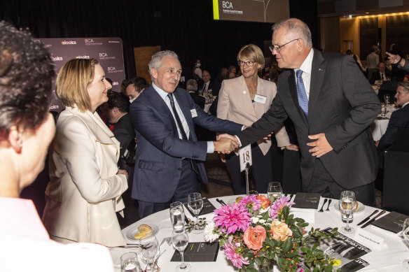Prime Minister Scott Morrison greets (from left to right) Susan Lloyd-Hurwitz (head of Mirvac), Andrew Penn (Telstra) and Alison Watkins (Coca-Cola Amatil) at the Business Council of Australia’s annual dinner.