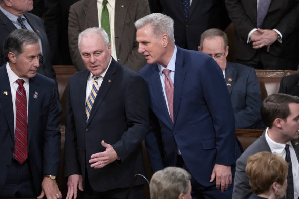 Kevin McCarthy, then the House Republican leader, confers with Minority Whip Steve Scalise, left, before Ukrainian President Volodymyr Zelensky speaks in December.