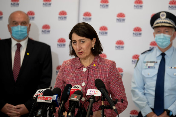 NSW Premier Gladys Berejiklian, flanked by Police Minister David Elliott and NSW Police Commissioner Mick Fuller.