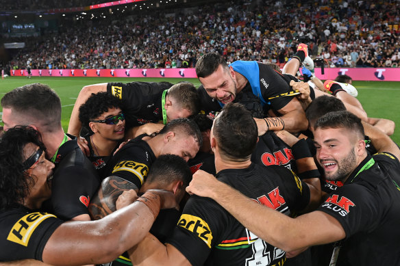 Penrith players celebrate their first premiership in 18 years.