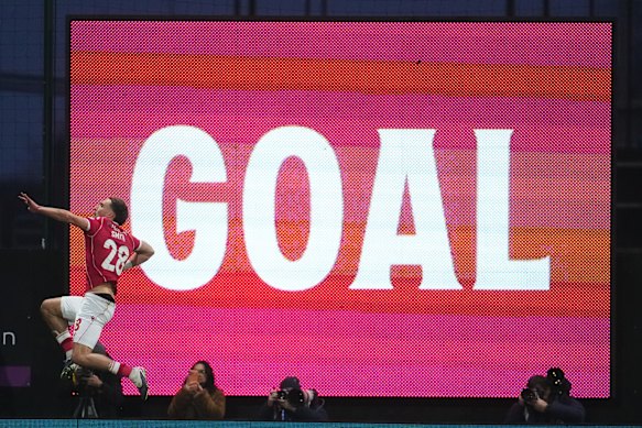 Sam Smith scores for Wrexham against Chelsea.