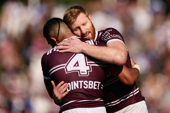 Brad Parker celebrates with Tolutau Koula during the Sea Eagles’ first-up win over Canterbury earlier this month.