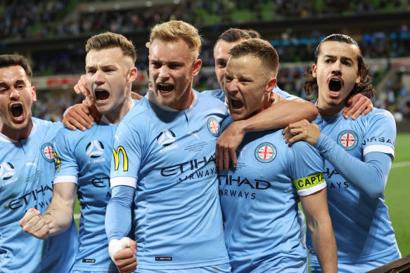 Melbourne City celebrate Scott Jamieson’s goal just before half-time.