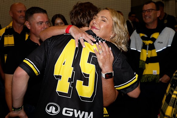 Debutant, Tom Burton of the Tigers is seen with family.
