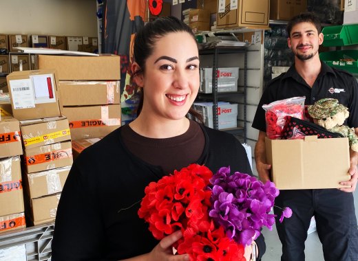 Staff members Caris and David Fischetti  at The Military Shop in Canberra, which supplies poppies to RSL clubs.