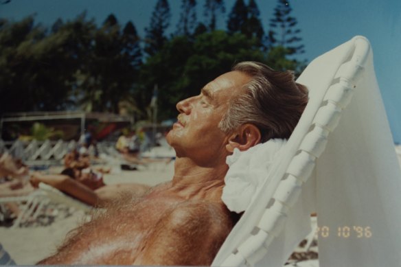 Steve Ostrow reclining on a beach, possibly in Thailand.