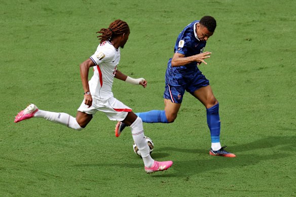Djed Spence chases Kylian Mbappe. 