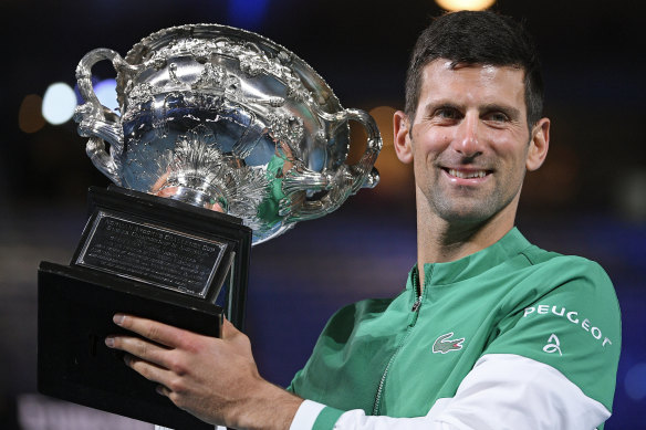Novak Djokovic with his spoils after winning the 2021 Australian Open. 