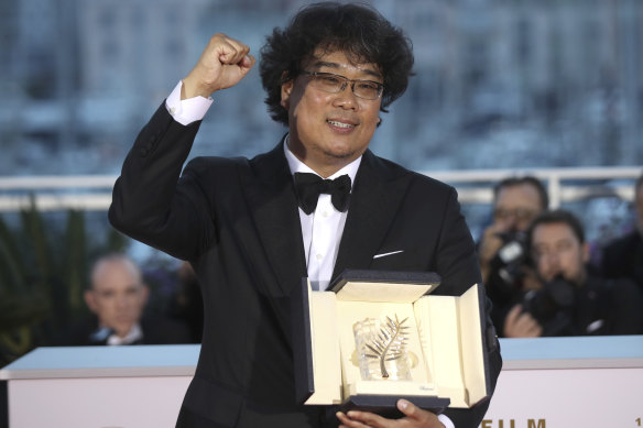 Globe frontrunner: Director Bong Joon-ho with his Palme d'Or award for the film Parasite. 