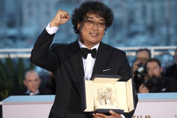 Globe frontrunner: Director Bong Joon-ho with his Palme d'Or award for the film Parasite. 