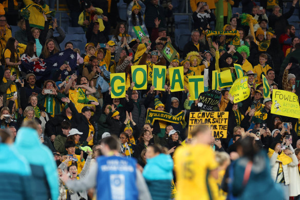 Fans celebrate after the Matildas 2-0 victory. 