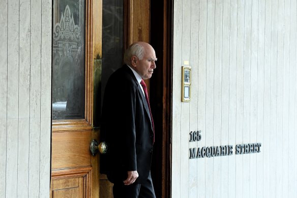 Former Prime Minister John Howard leaves the men’s only Australian Club after holding a vote to determine if women can become members.