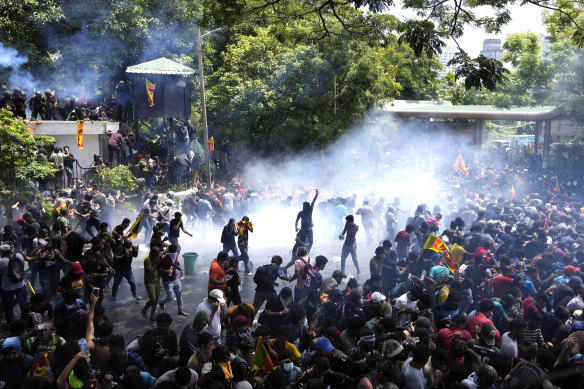 Police use tear gas to disperse protesters who stormed the office of Prime Minister Ranil Wickremesinghe on Wednesday.