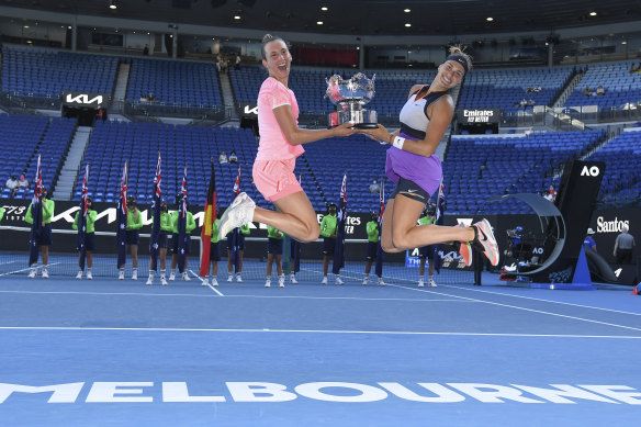 Belgium’s Elise Mertens (left) and Aryna Sabalenka of Belarus celebrate with their trophy after winning the women’s doubles final on Friday.