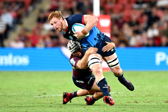 The Rebels’ Brad Wilkin attempts to break away from the defence.