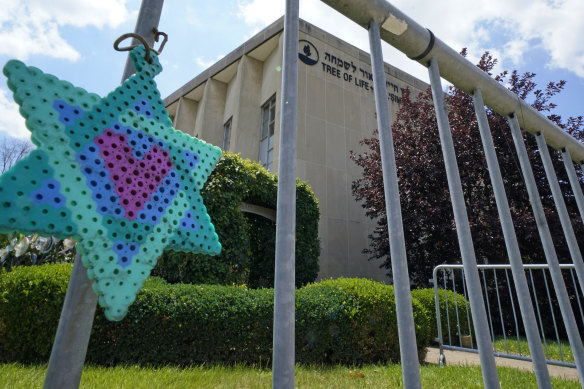 A Star of David hands from a fence outside the dormant landmark Tree of Life synagogue in Pittsburgh’s Squirrel Hill neighbourhood.