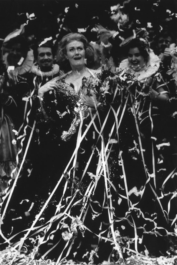 Dame Joan Sutherland covered in streamers during her final bow after her last performance at the Opera House in 1990. 

