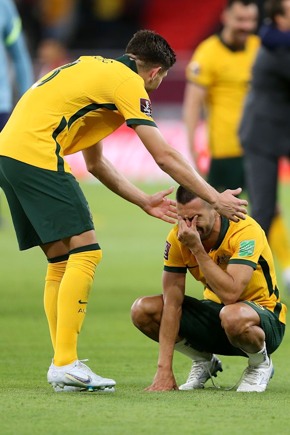 Fran Karacic and Aziz Behich react in the immediate aftermath of their heart-stopping win.