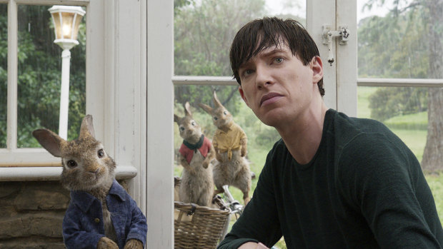 Domhnall Gleeson with Peter Rabbit, voiced by James Corden, in Peter Rabbit.