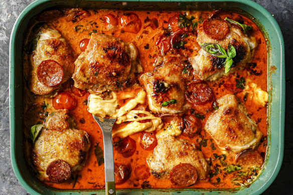 Tip: Instead of a roasting tray (pictured), use an ovenproof frypan to turn this pizza-inspired chicken bake into a one-pan wonder.