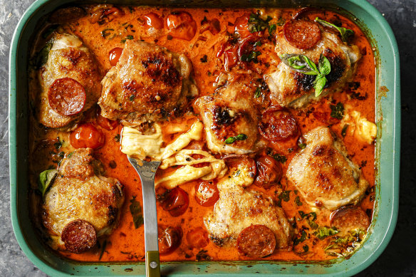 Tip: Instead of a roasting tray (pictured), use an ovenproof frypan to turn this pizza-inspired chicken bake into a one-pan wonder.