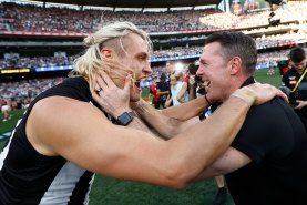 Captain Darcy Moore and coach Craig McRae celebrate Collingwood’s grand final win over the Brisbane Lions.