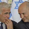 Israeli Prime Minister Naftali Bennett, right, has ceded his role to Foreign Minister Yair Lapid until the election in Autumn. 