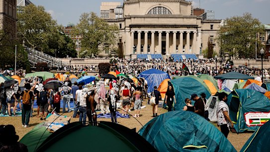 Students protesters gather at their encampment on the Columbia University campus.