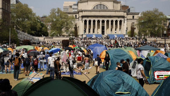 Students protesters gather at their encampment on the Columbia University campus.