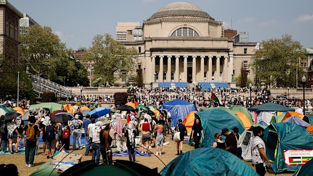 Students protesters gather at their encampment on the Columbia University campus.