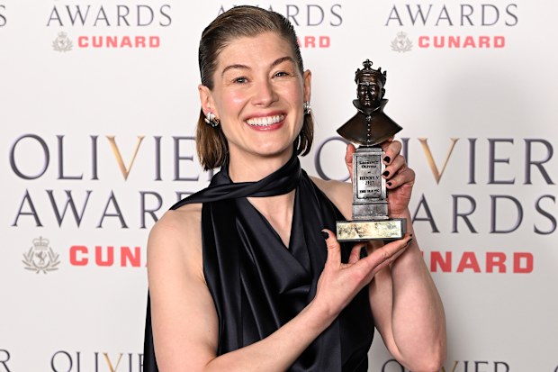 Rosamund Pike holding her Olivier Award for Best Actress, winning for her performance in Inter Alia at the 2026 ceremony