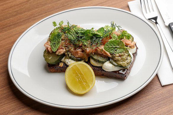 Salmon on house-baked dark rye with whipped goat's cheese and pickles.