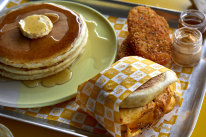 The Happiest Meal comprises two hash browns, a “McLovin Muffin” with egg, cheese and chicken sausage, and three pancakes.