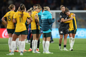 Australia players look dejected after the team’s 1-3 defeat and elimination from the tournament.