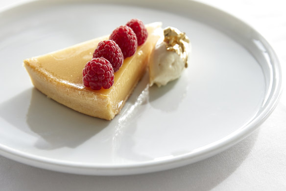 Textbook lemon tart with fresh raspberries and lemon mascarpone.