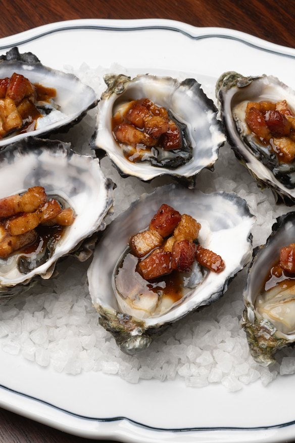 Oysters Kilpatrick are doused in Fancy Hanks sauce.