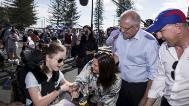 Prime Minister Scott Morrison, his wife Jenny and Petrie MP Luke Howarth meet Sophie during a street walk.