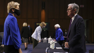 Senator Elizabeth Warren speaks with US Fed chief Jerome Powell during a Senate Banking, Housing and Urban Affairs Committee hearing in Washington.
