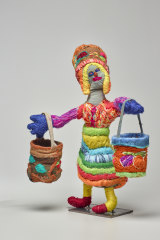 Marlene Rubuntja’s ‘Woman with Dilly Bags and Dilly Bag hat’ 2019.