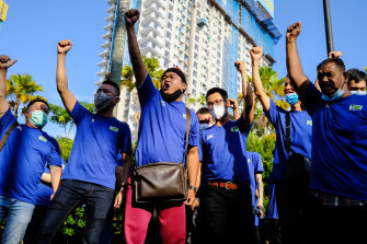 Supporters of former Malaysia prime minister Najib Razak chant outside the Kuala Lumpur Courts Complex before the verdict on Tuesday.