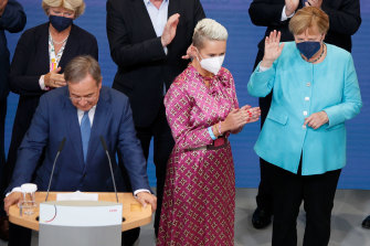 Angela Merkel is given a round of applause at the election night party.