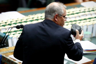 Then Treasurer Scott Morrison holds up a lump of coal during Question Time at Parliament House in February 2017. 