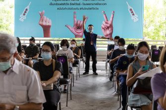 People wait in an observation area at a vaccination hub set up in a Bangkok shopping centre after receiving the AstraZeneca Covid-19 vaccine on Monday.