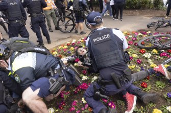 Anti-lockdown protesters clash with police in Victoria Park. 